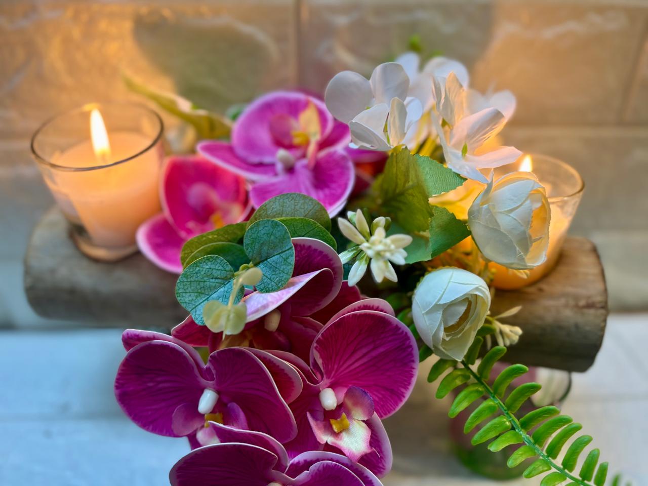 Petal Glow – Orchid & Candle Floral Arrangement